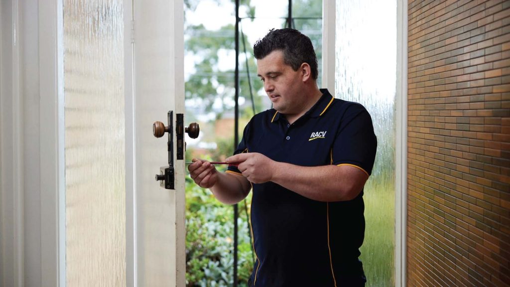man fixes door
